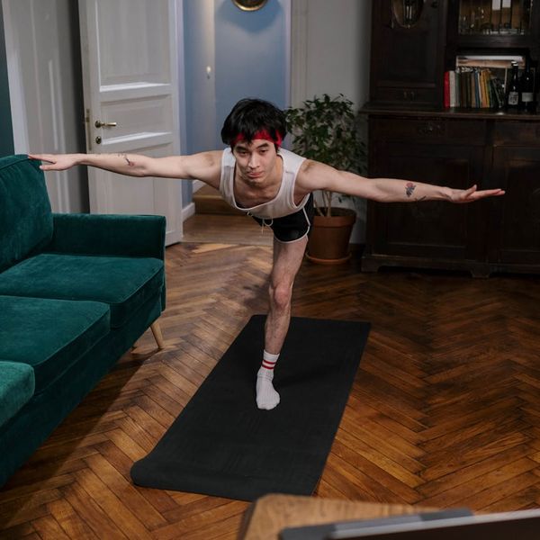 Person holding a challenging yoga pose demonstrating strength.